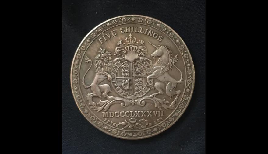 An old five shillings coin