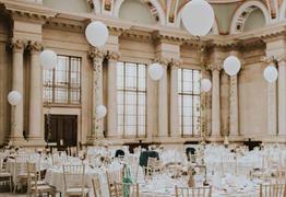 Bristol Harbour hotel wedding venue hall with white balloon centre pieces