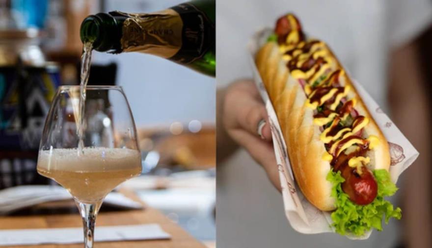 A picture of champagne and a hot dog