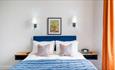 Bed with blue bedding
