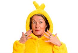 Nikky Smedley wearing a yellow teletubby suit