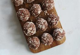 Chocolate truffles on a wooden board