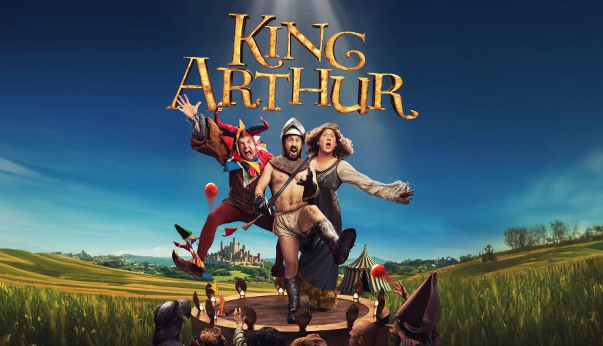 King Arthur poster with three actors in costume on grassy background