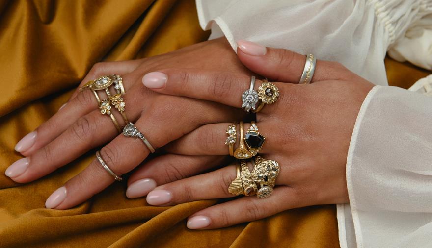 Female hands adorned with gold and silver rings