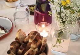 bread and candles on table