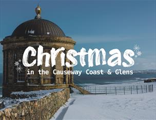 Mussenden Temple in snow. Text reads: Christmas in the Causeway Coast & Glens