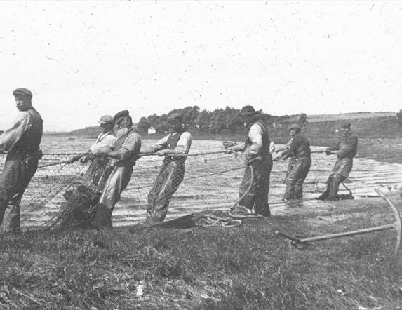 an old photograph of fishermen