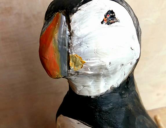 A hand sculpted puffin.