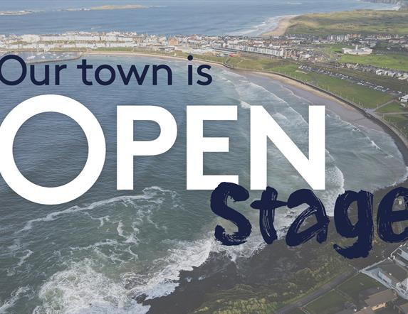 text reads 'Our Town is Open stage' overlayed on an aerial image of Portrush
