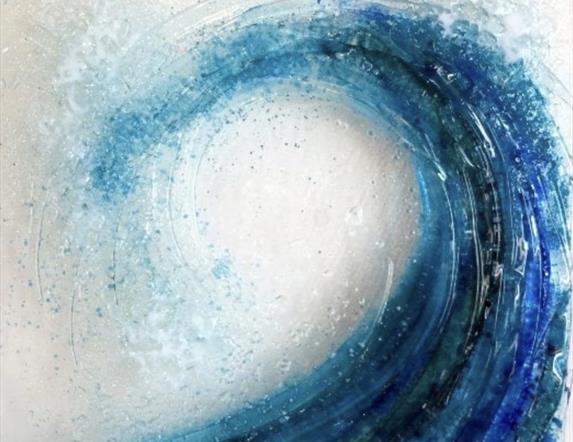 glass art depicting a sea wave