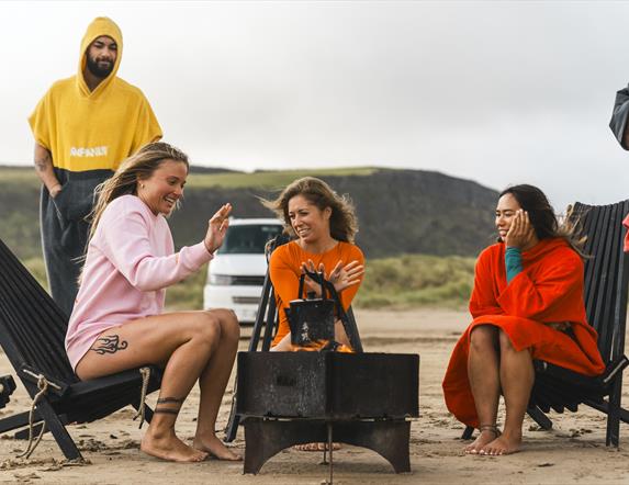 people relax around the fire pit