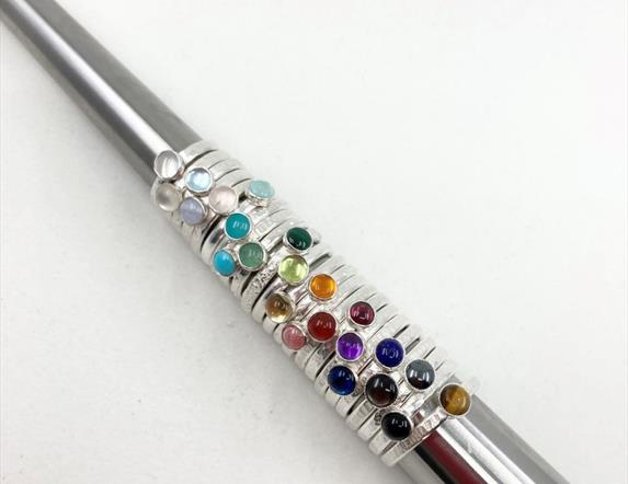 A selection of beautiful silver stacking rings with semi-precious stones