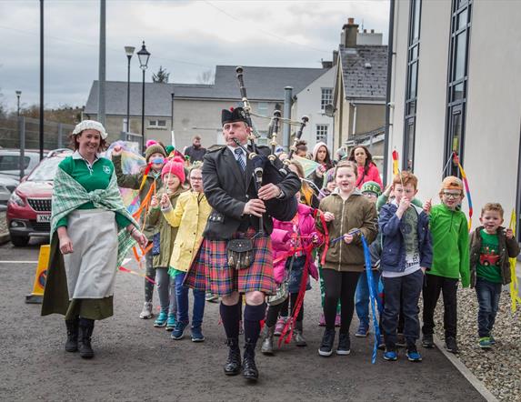 Ballycastle Community Parade led by a piper  in St Patrick's day 2018