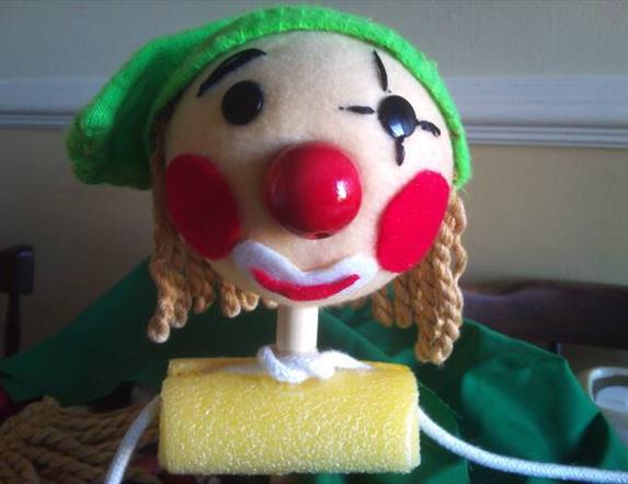 close up for a rod puppet's face that looks like an elf.