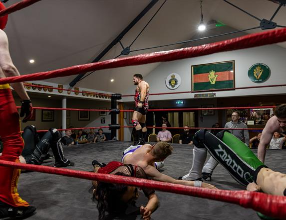 A number of wrestlers performing in ring at the Ballymoney Legion Hall.