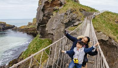 Father and Son on Carrick-a-Rede Rope Bridge taking a selfie