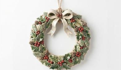 a small wreath made out of ceramic 