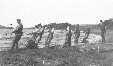 an old photograph of fishermen