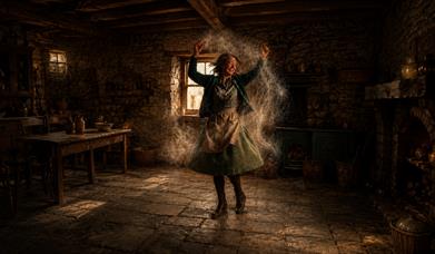 a woman dancing in a cottage