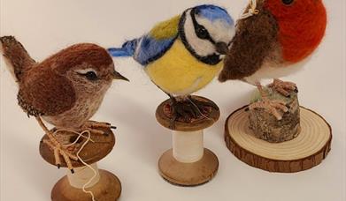 3 needle felted birds on little wooden stands
