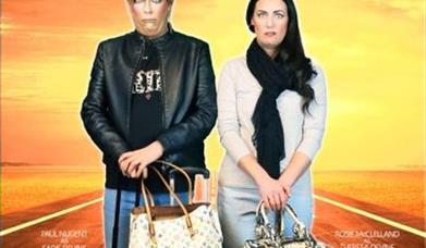 Image of two peoplewith suitcases