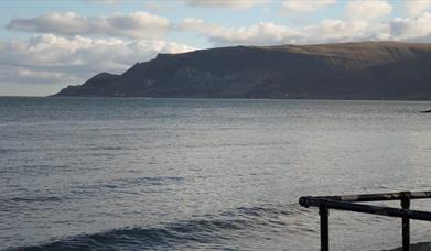 a view over the sea out towards Glenariff from Cushendall Beach