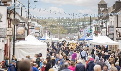 Crowds and stalls fill the main street in Bushmills