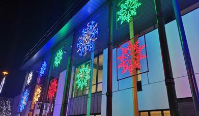 Colourful snowflakes line the side of the Roe Valley Arts & Cultural Centre building