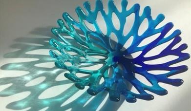 a colourful glass bowl shaped like coral