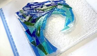 fused glass sea wave on a white background