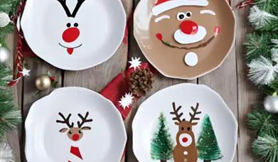 image for 4 festive decorated plates, with Christmas characters. 