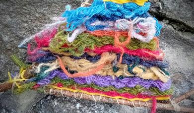 colourful tapestry wefts on twigs