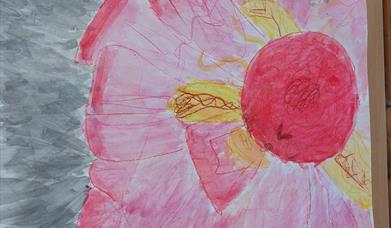 A large hand painted pink flower with some yellow petals. 