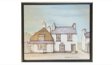 a framed drawing of a traditional irish home with a partially thatched roof