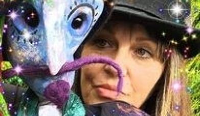 paddy picasso with one of her brightly coloured puppets
