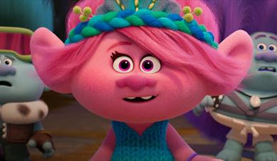 screenshot from the movie trolls with one of the main characters