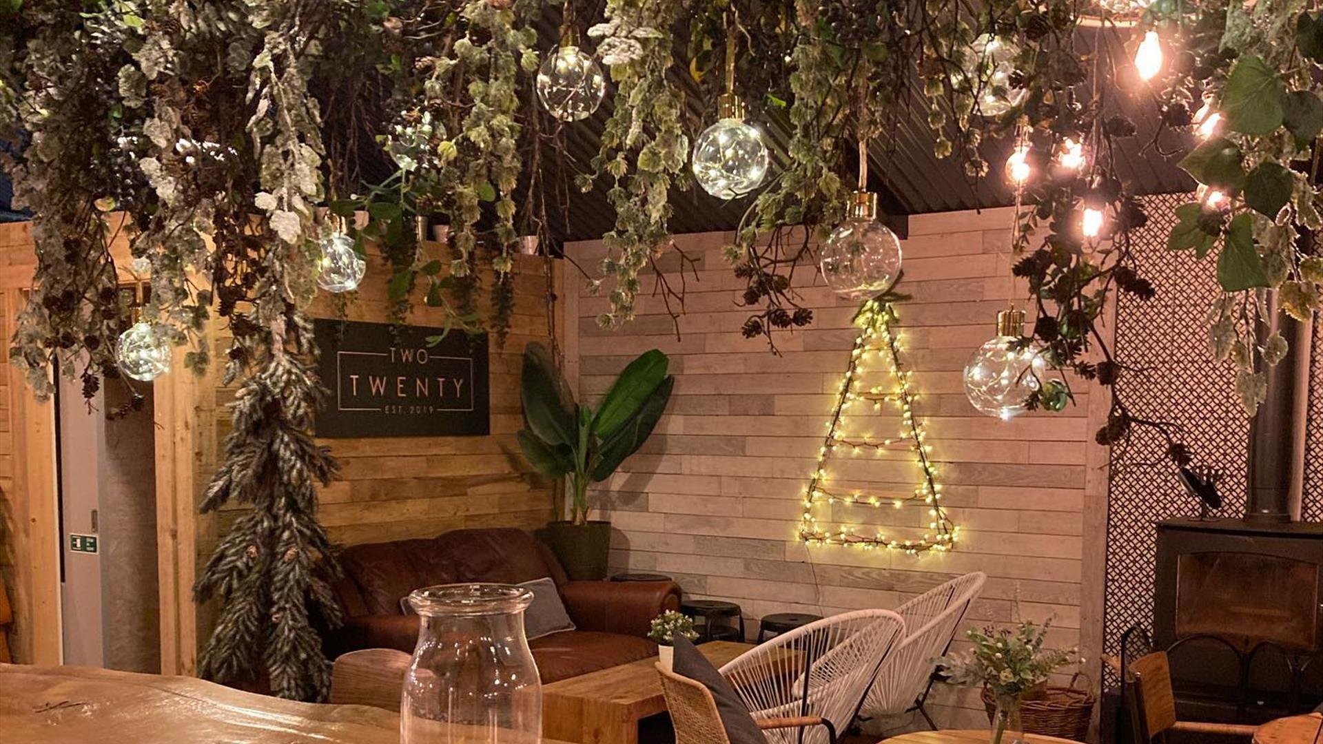 Two Twenty interior decorated with festive garlands and lights