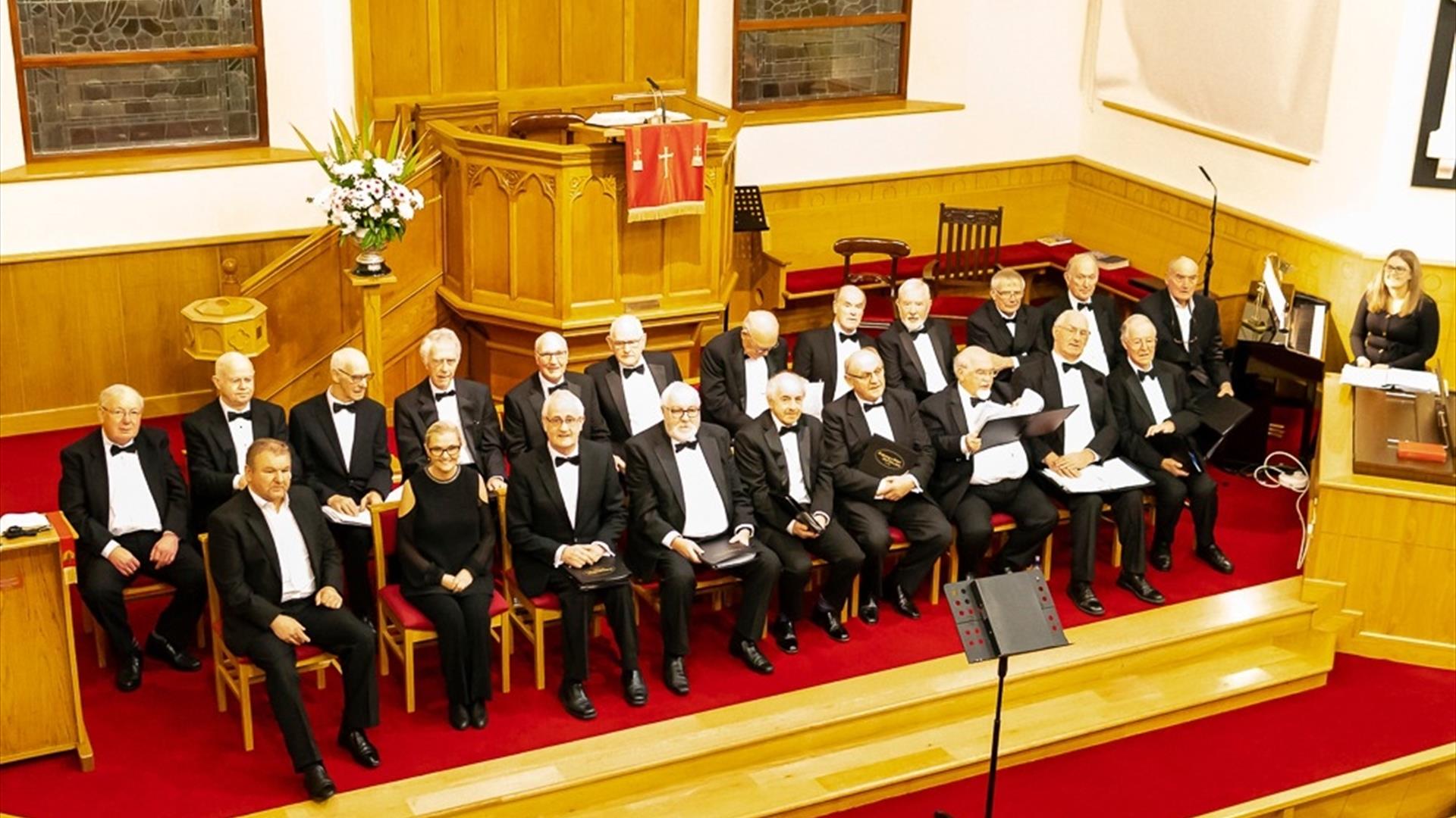 image of Ballymoney & District Male Voice Choir seated in a church