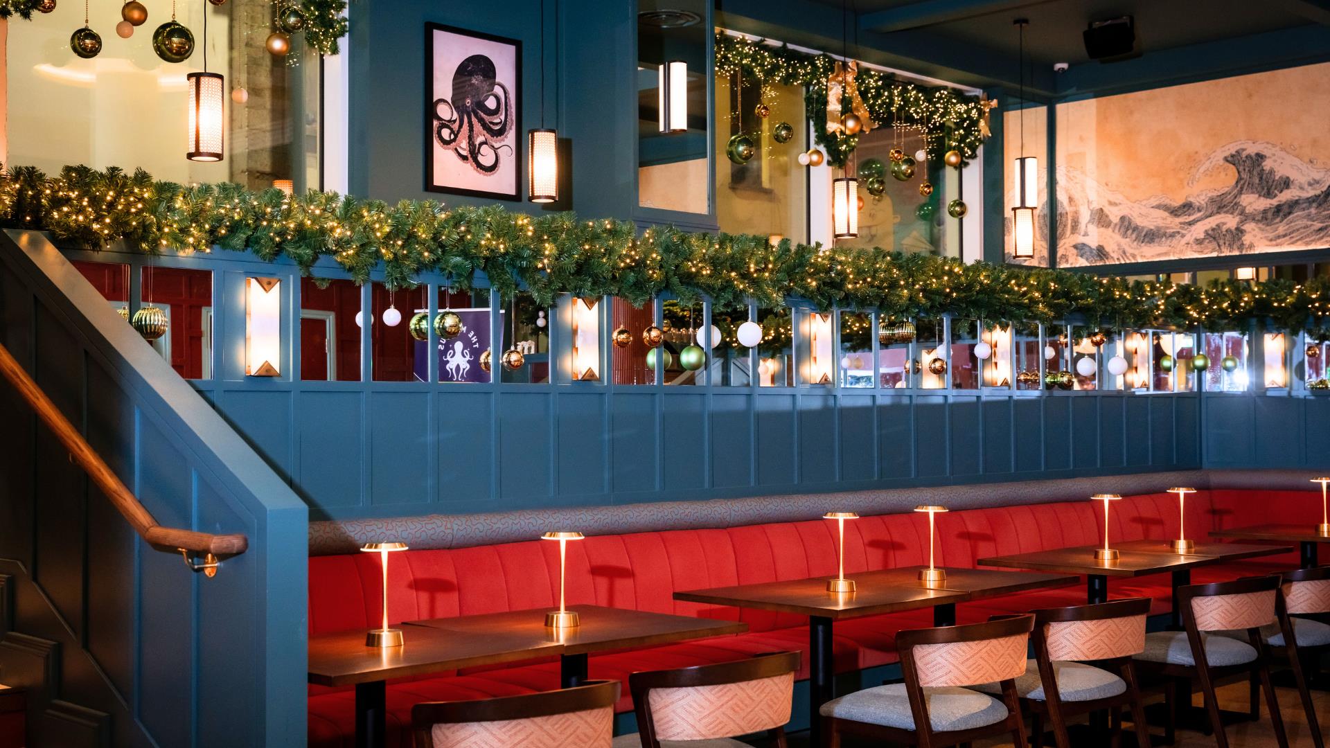 interior of Nemesis Asian Fusion restaurant decorated for Christmas with festive garlands