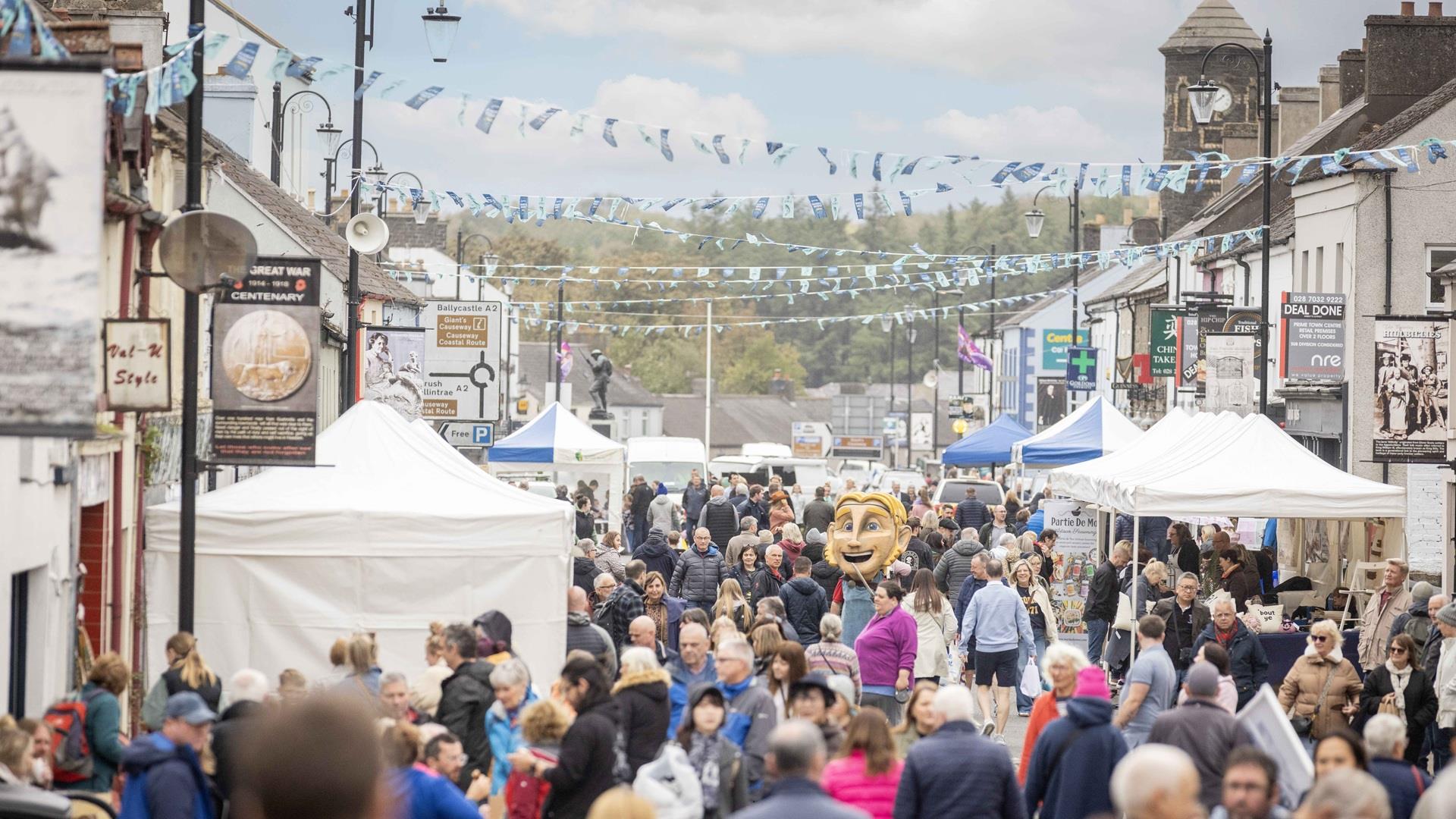 Crowds and stalls fill the main street in Bushmills