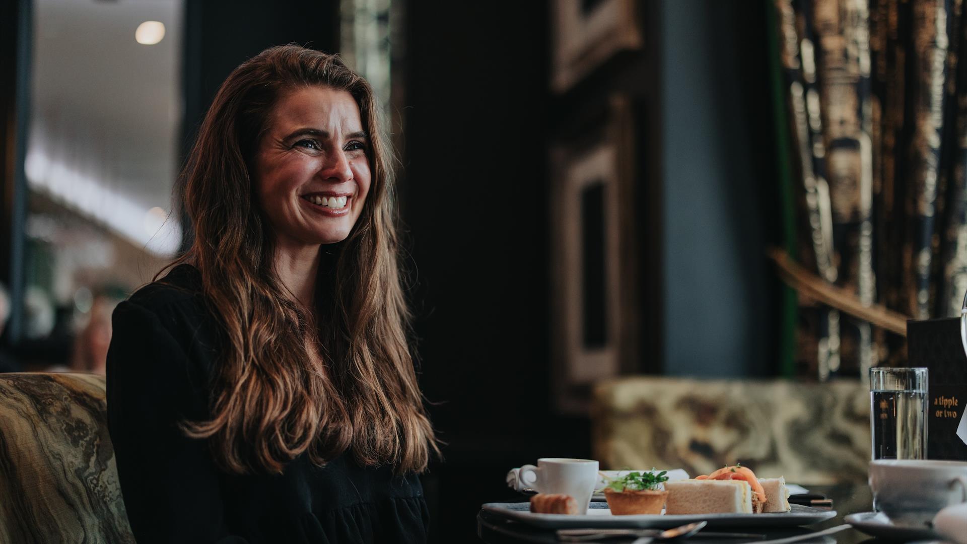 woman sitting down for lunch at the elephant rock hotel