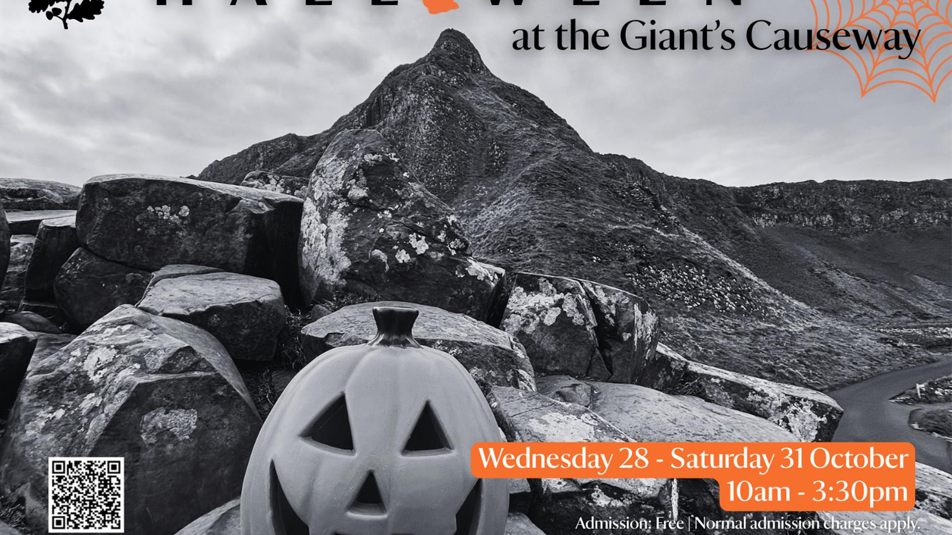 Promotional poster for 'Halloween at the Giant's Causeway' event. Carved pumpkin sitting on top of the Causeway stones, with a dramatic black and whit
