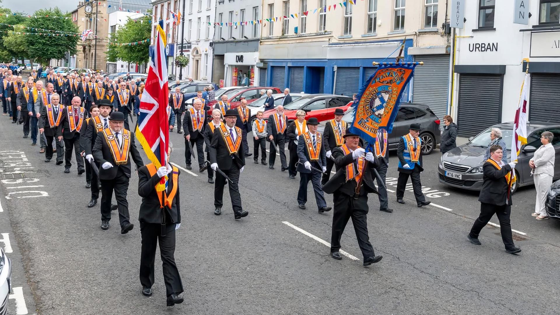 a parade band proceeding on the main street in limavady