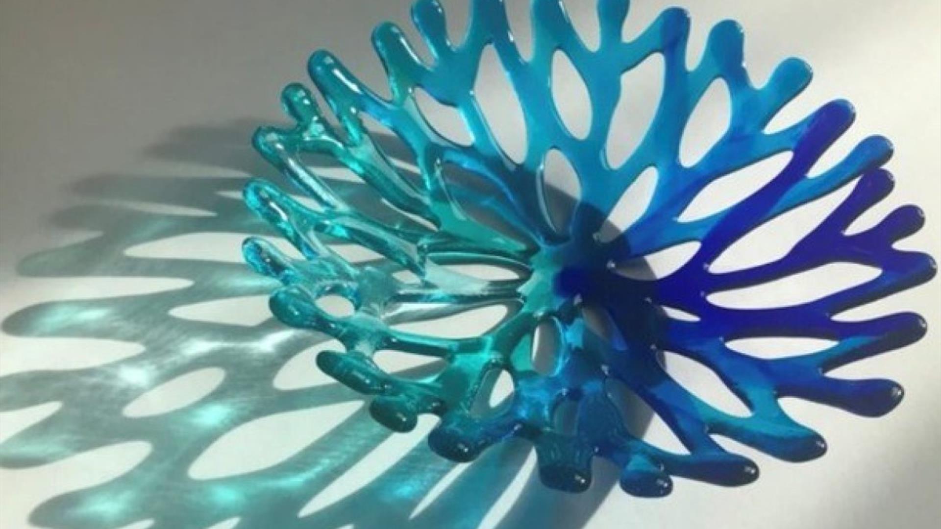 a colourful glass bowl shaped like coral