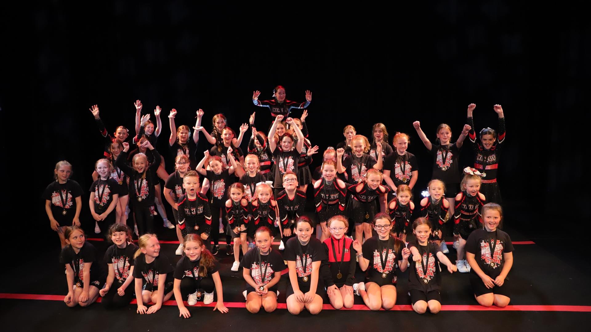 Image shows a group of dancers on stage