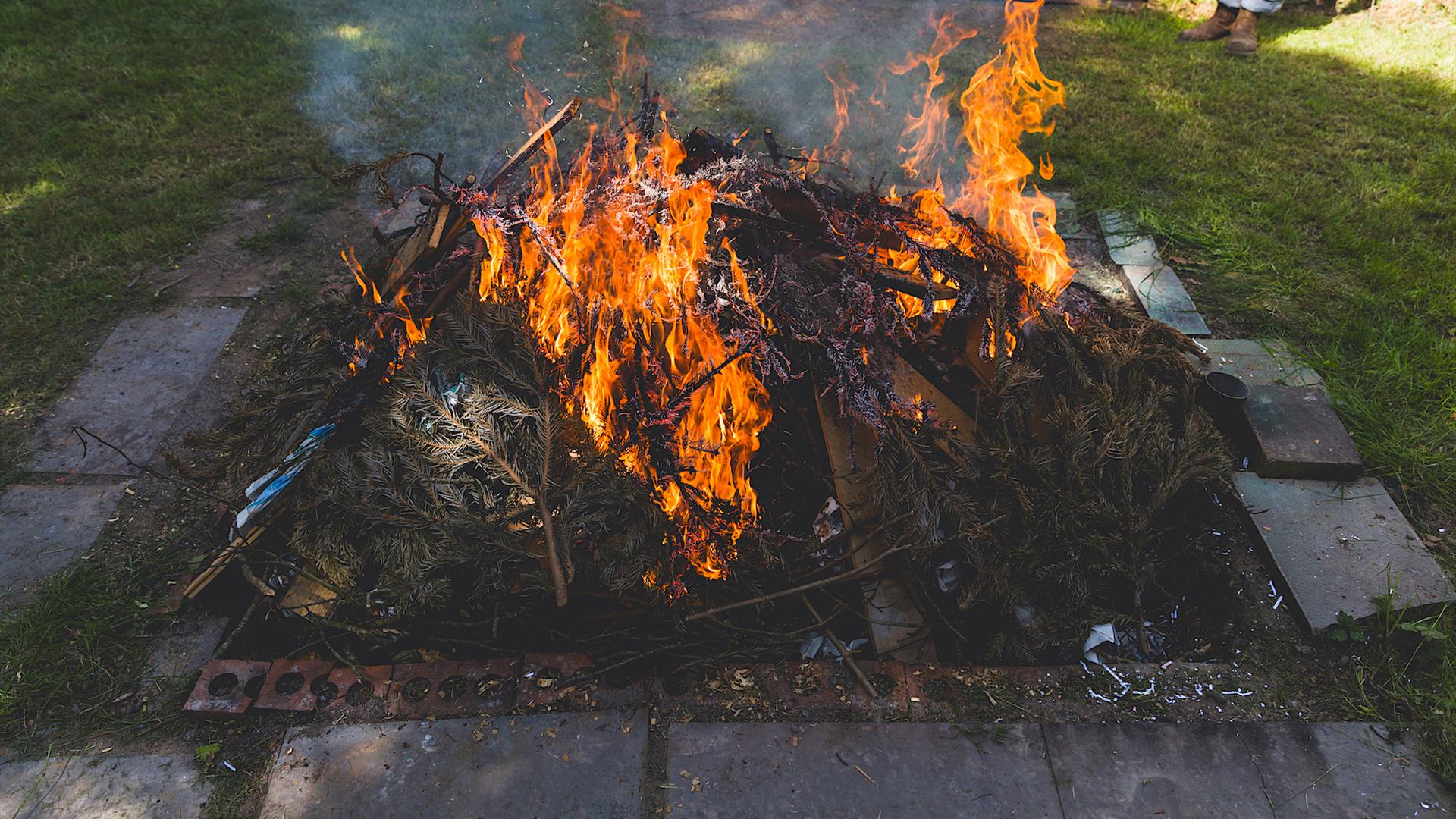 an earthen pit of flames used for firing pottery
