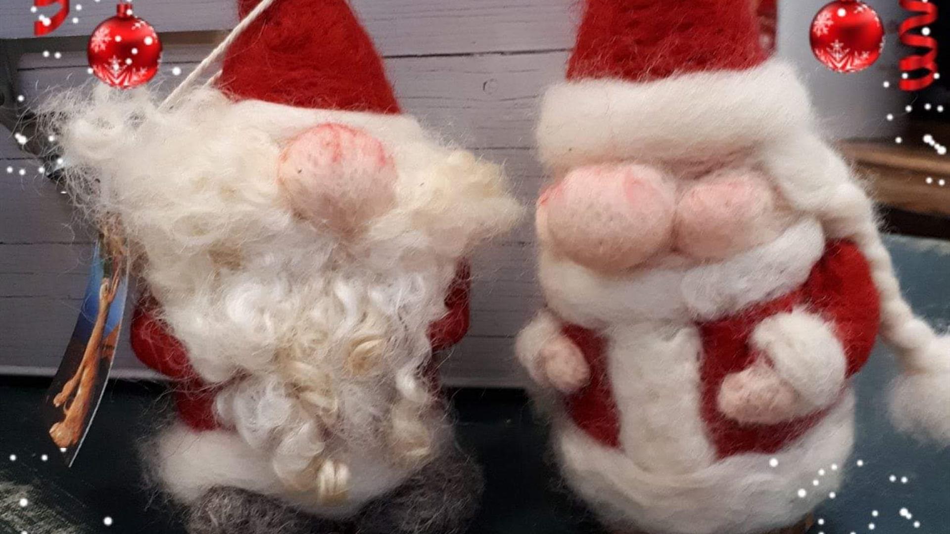 Image of a needle felted Santa and Mrs Clause