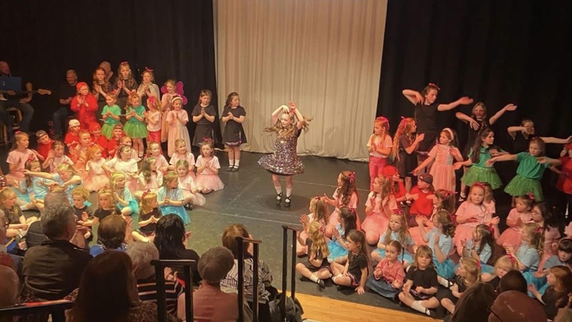 Image of Irish dancers performing on stage at Roe Vallet Arts Centre.