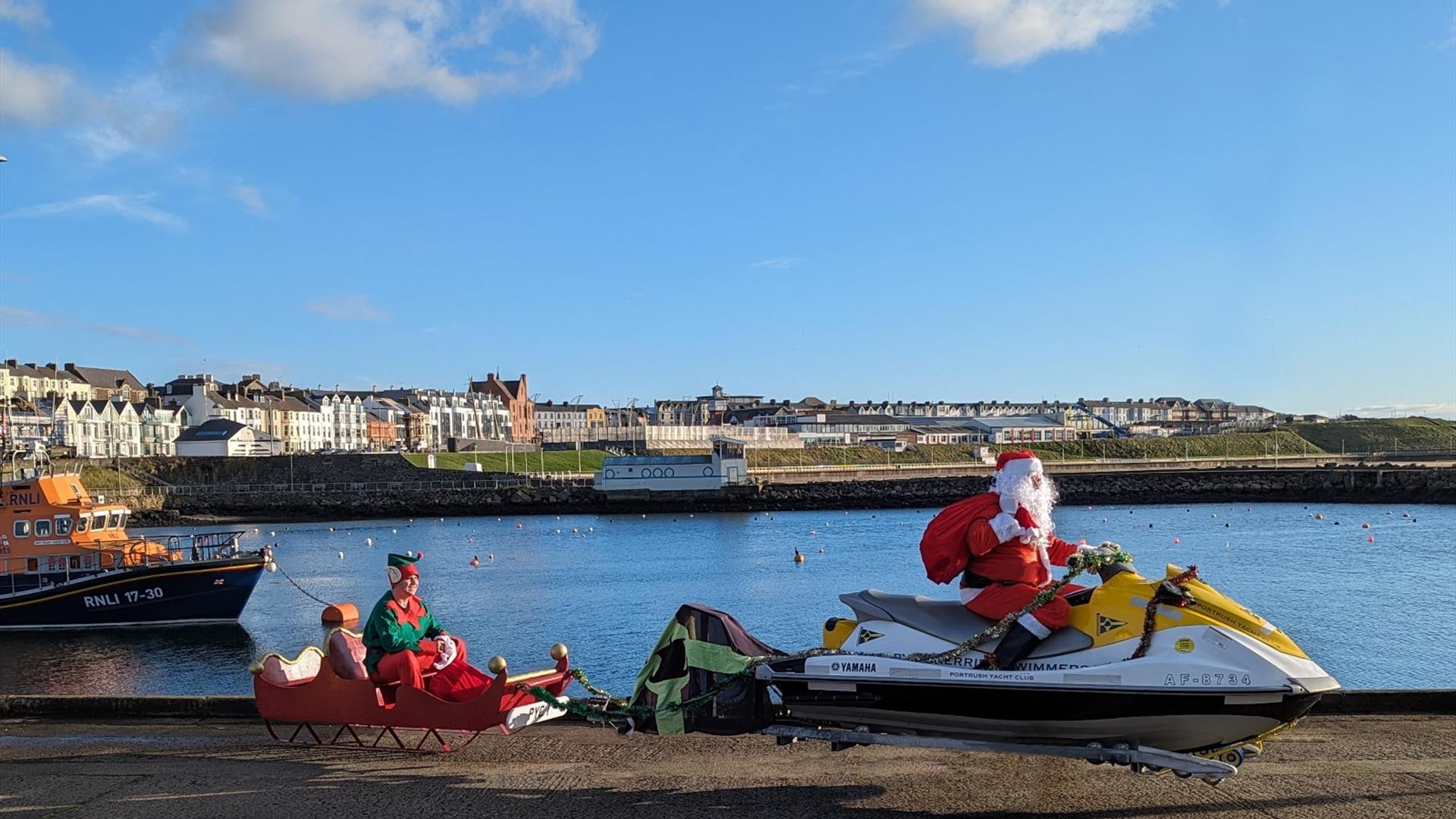 Santa & Elf visit Portrush Yacht Club by Jet Ski