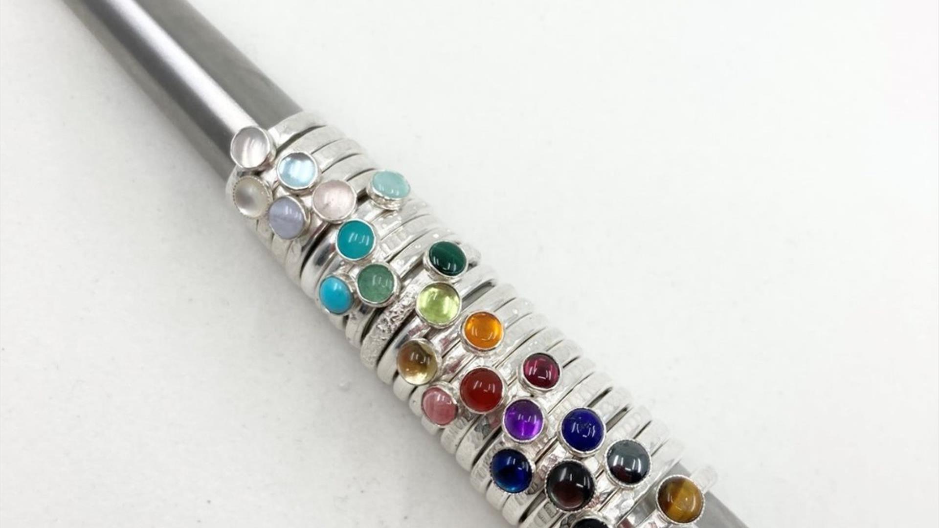A selection of beautiful silver stacking rings with semi-precious stones